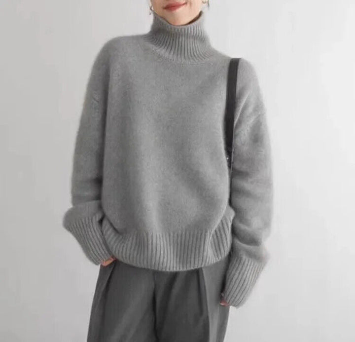 Women's soft knit turtleneck sweater, relaxed fit, perfect for cozy fall & winter fashion. Long sleeve comfort.