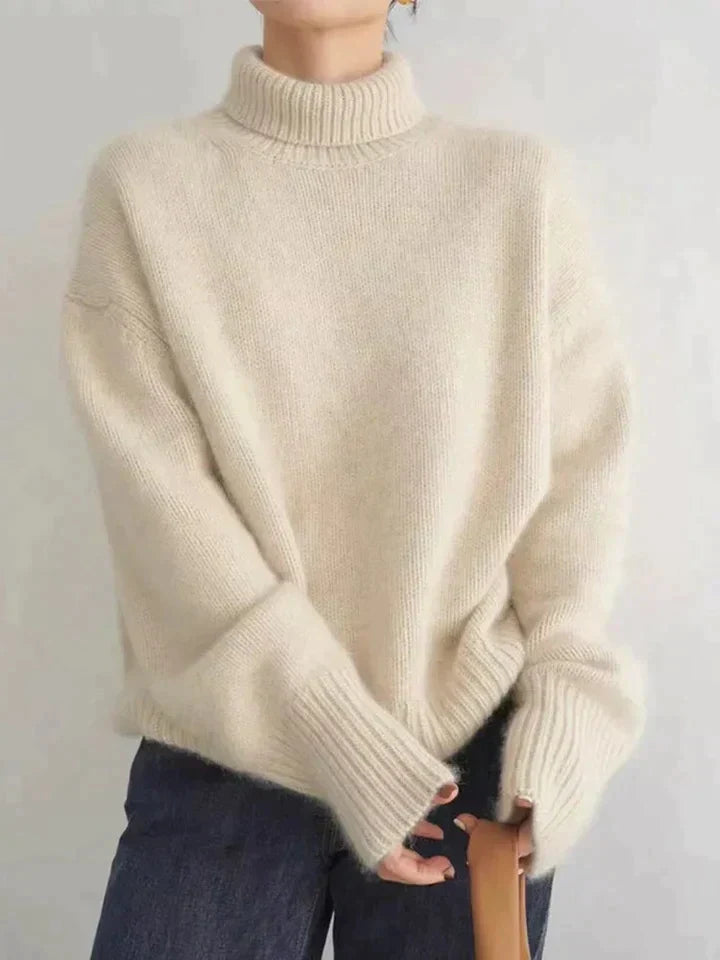 Cozy women's soft knit long sleeve turtleneck sweater with a relaxed fit, ideal for elegant fall & winter wear.