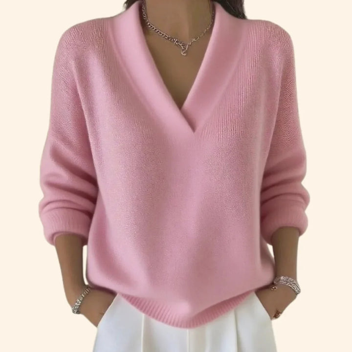 Close-up of a women's comfortable knit V-neck blouse, showcasing soft fabric and versatile, relaxed fit.