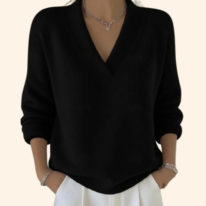 Stylish women's knit V-neck blouse with long sleeves and a relaxed fit, offering ultimate comfort and versatility.