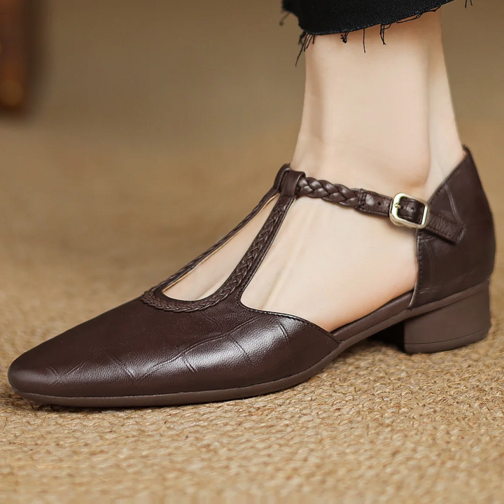 Soft genuine leather women's Mary Janes with a T-strap design, offering comfortable low heel support.