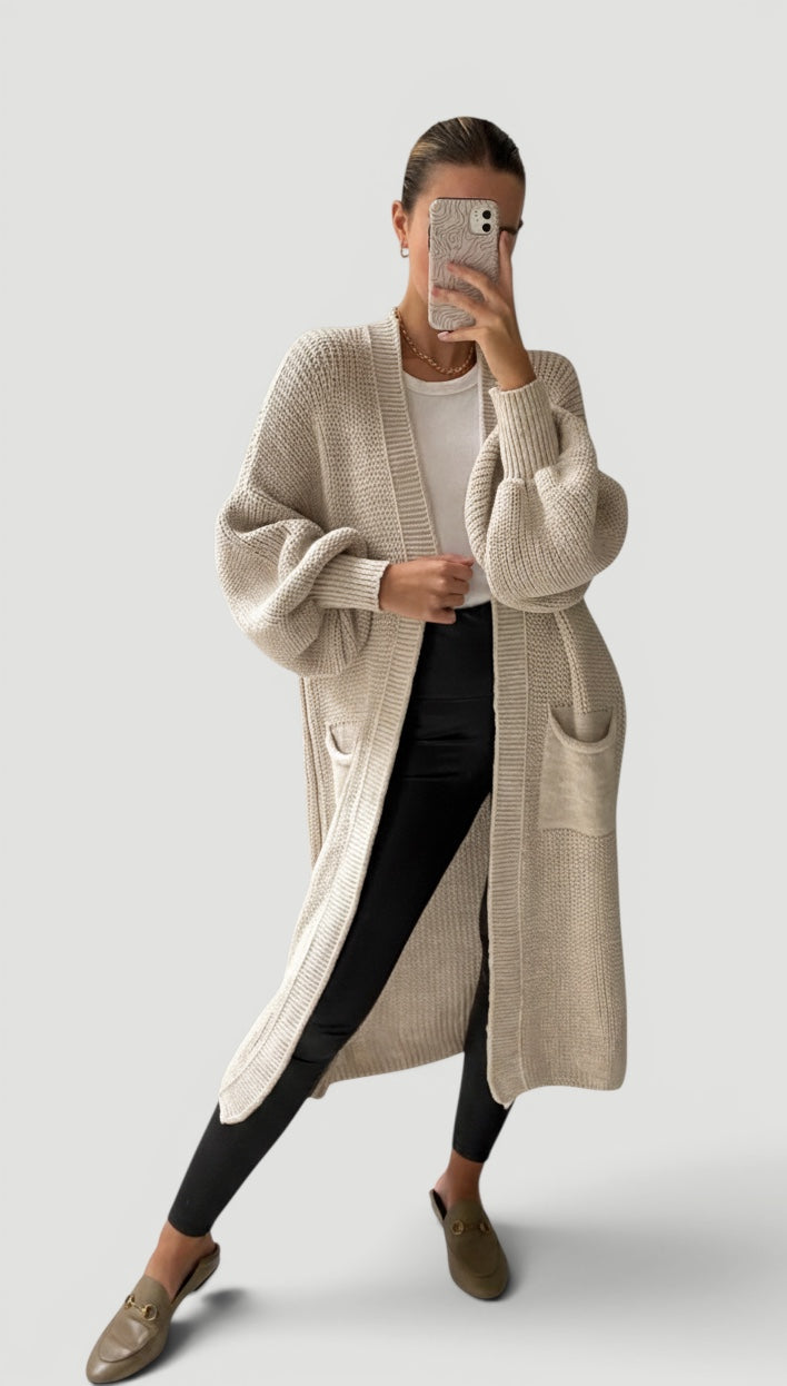 Elegant sand longline cardigan for women with soft bell sleeves. Perfect fall layering top, casual chic style.
