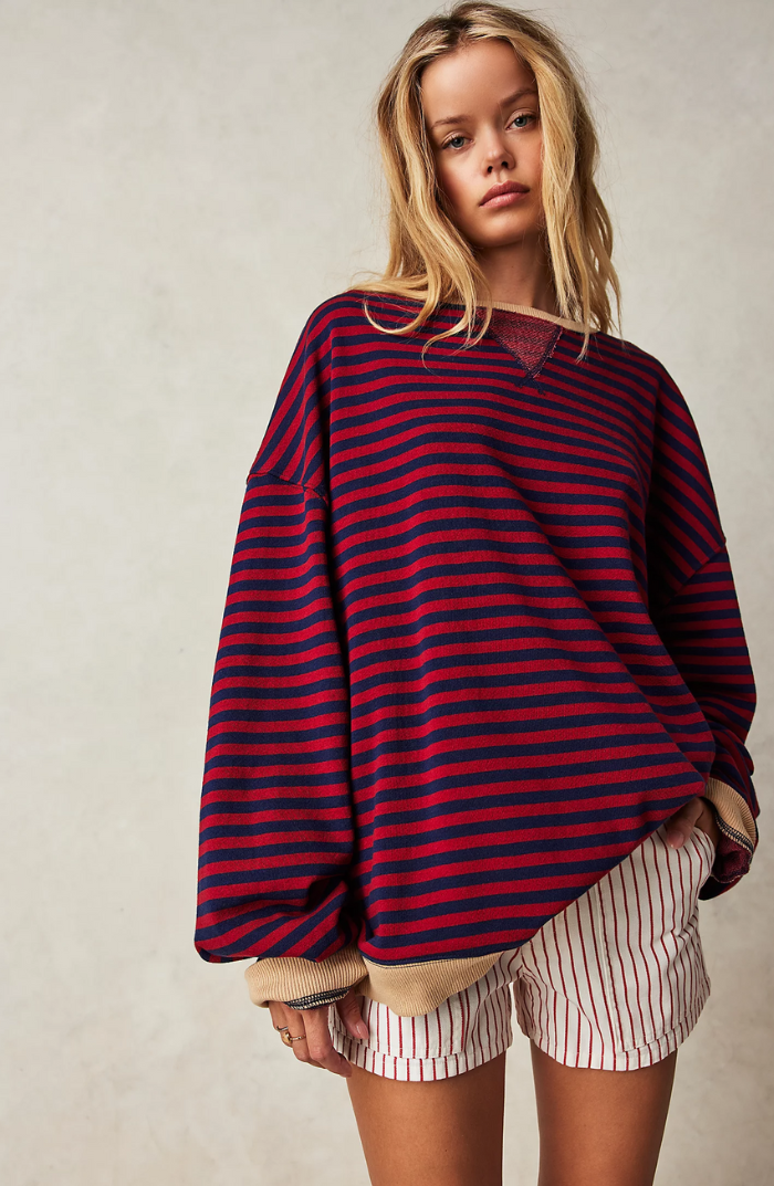 Ladies' versatile striped crewneck sweater, a comfortable choice for any casual occasion.