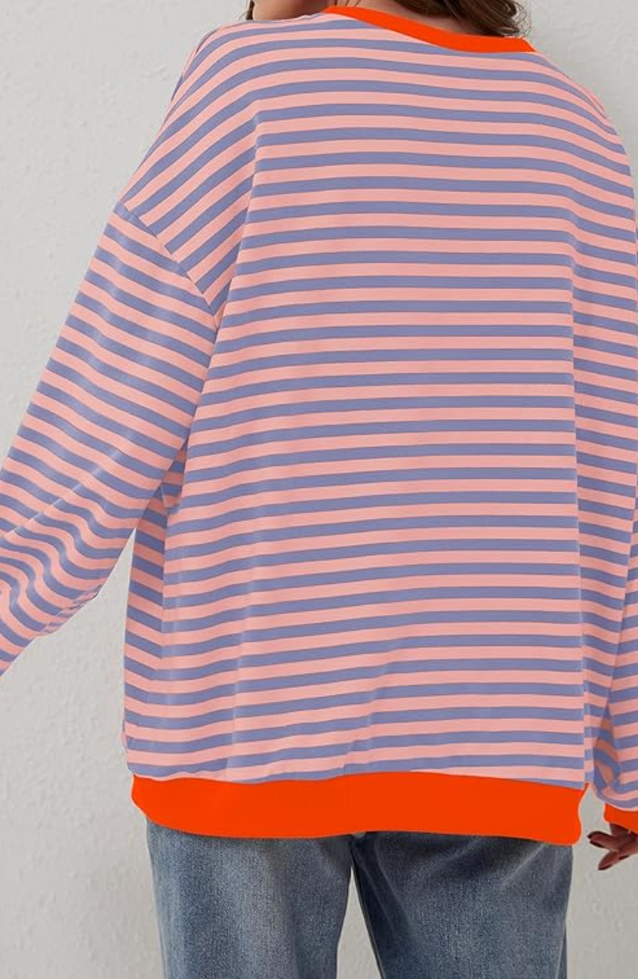 Soft knit women's striped crewneck sweater, offering cozy comfort for cold weather.