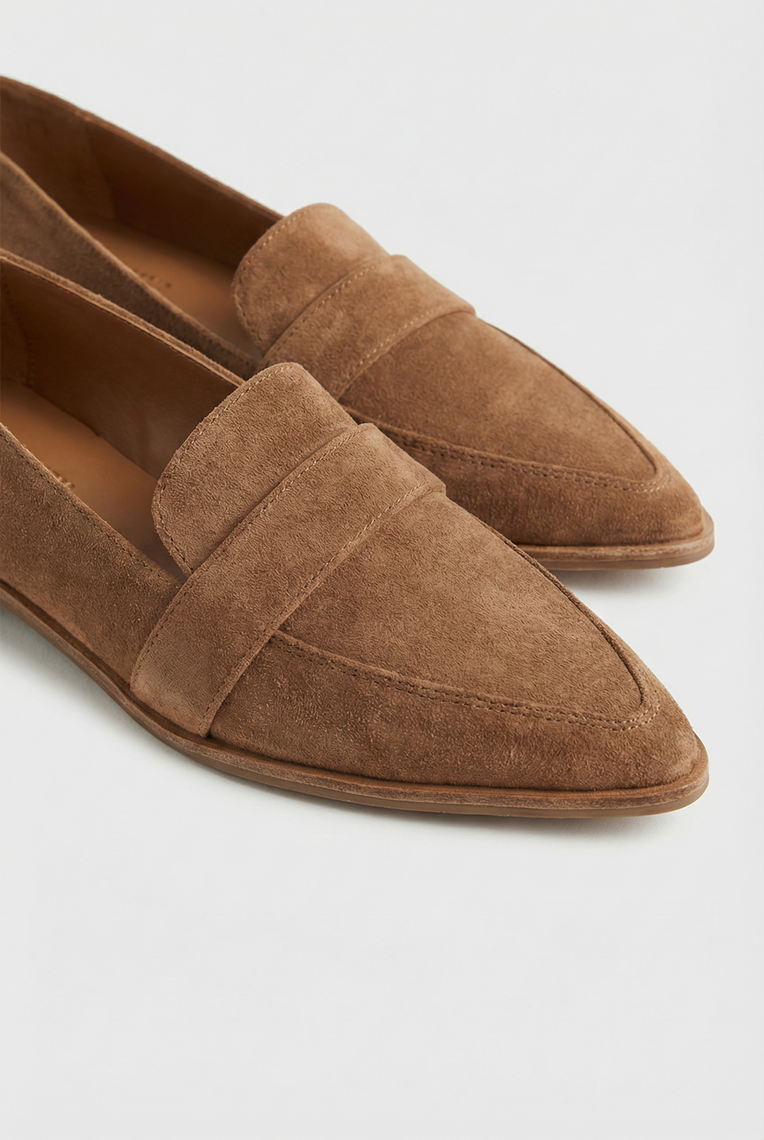 Close-up of soft suede texture on women's comfortable khaki loafers