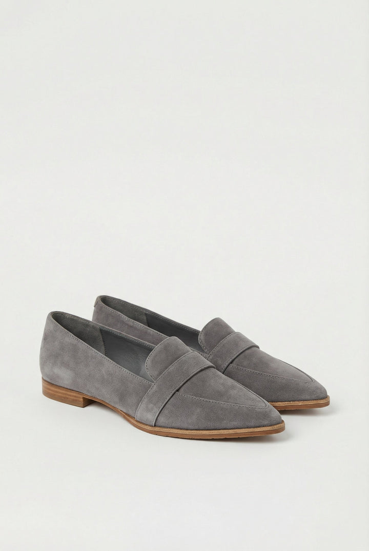 Stylish black suede slip-on shoes for women's comfortable, casual outfits