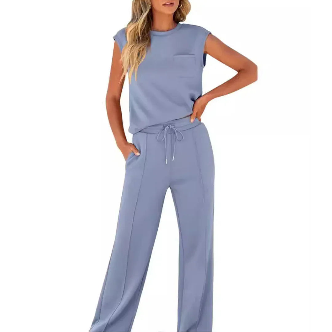 Casual women's co-ord set, soft grey, for summer. Includes short-sleeve top & relaxed shorts, perfect for daily wear.