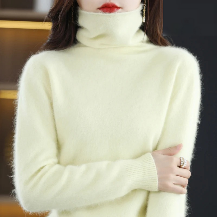 Women's soft turtleneck sweater, ideal for warm, luxurious winter fashion and everyday comfort.
