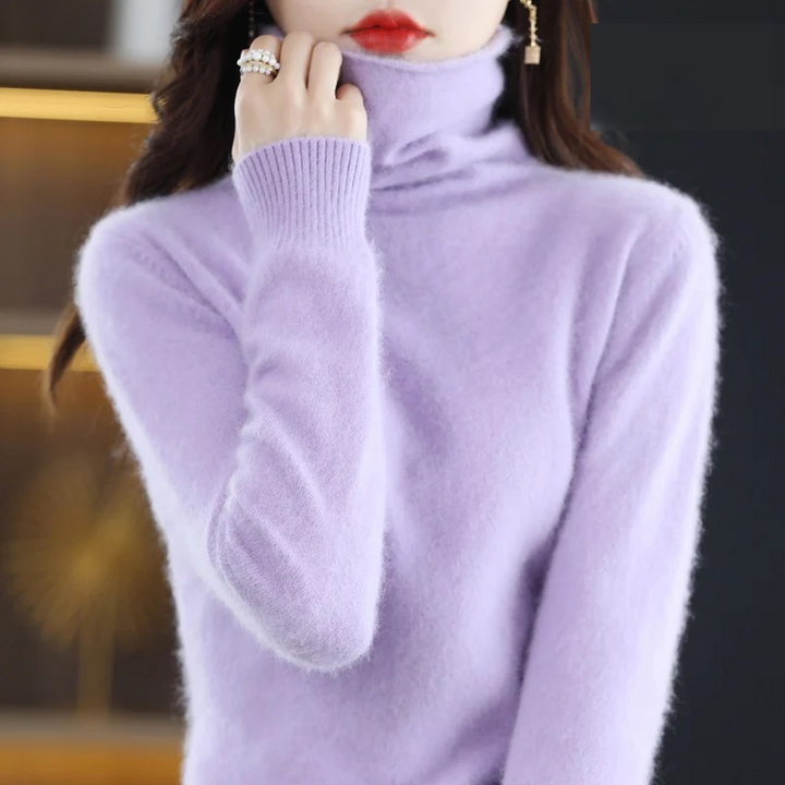 Warm long sleeve women's sweater, featuring a soft turtleneck for elegant casual wear.
