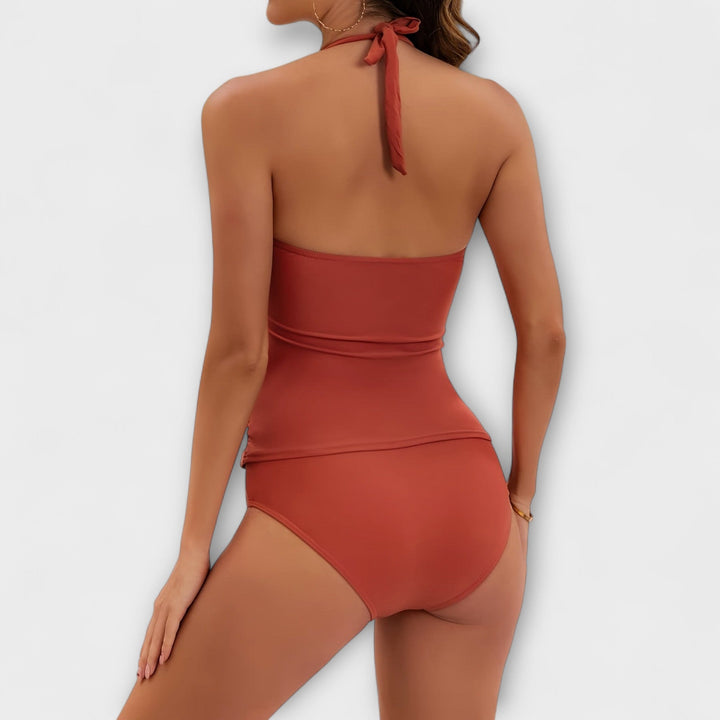 Complete your summer look with this women's solid halter two-piece swimsuit, ideal for stylish beach days.