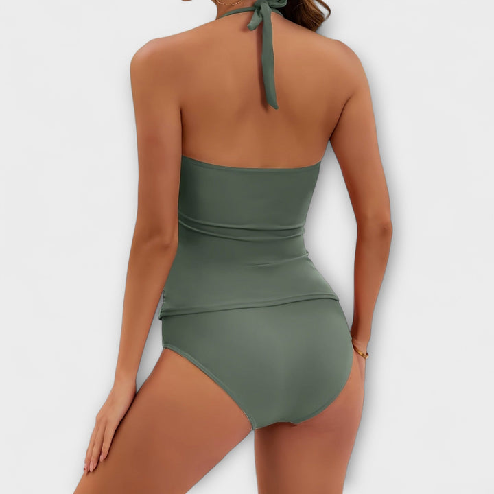 Vacation essential: Women's solid halter two-piece swimsuit for stylish summer fun by the pool or beach.