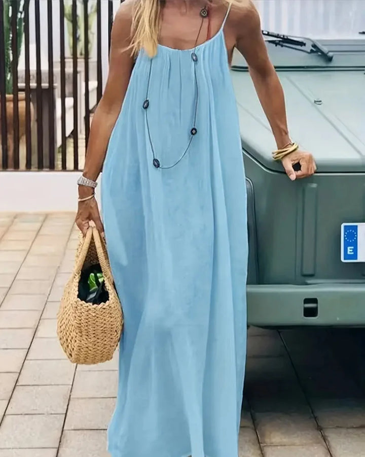 Flowy solid sleeveless maxi dress for women, offering a comfortable & casual summer look.