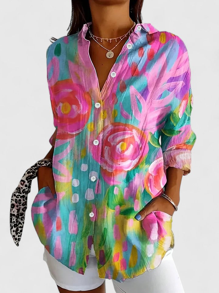 Women's sophisticated blouse with vibrant abstract print, perfect for versatile fashion and everyday style.