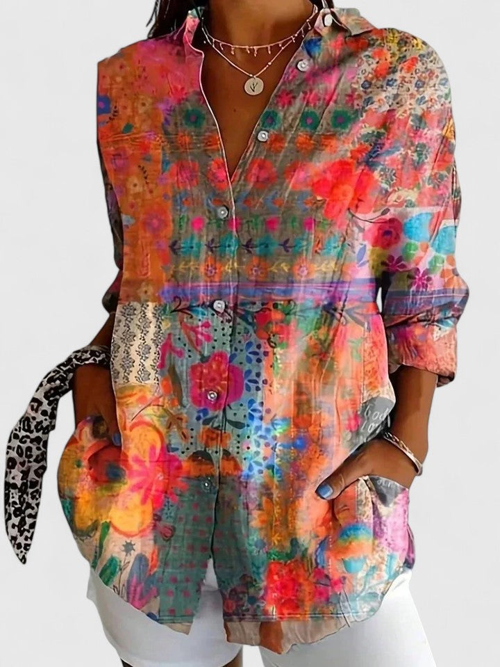 Elegant women's long sleeve blouse featuring a vibrant print, offering a comfortable fit for sophisticated casual wear.