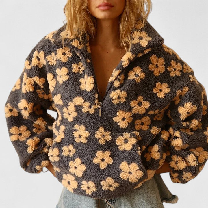 Women's sophisticated floral half-zip jumper with elegant yellow, pink, and orange patterns.