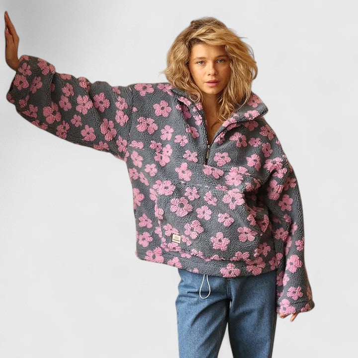 Elegant women's floral half-zip sweater. Comfortable long sleeve pullover with vibrant yellow, pink, orange flowers.