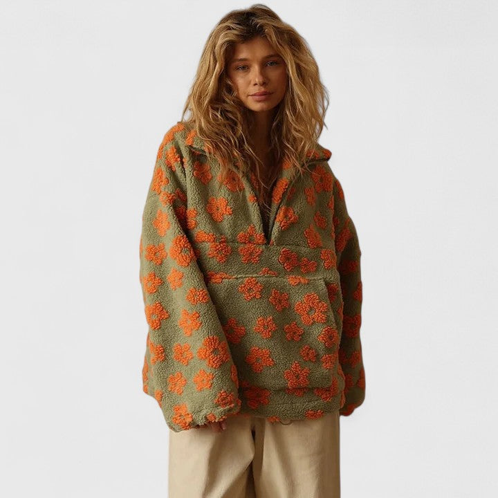 Casual women's half-zip floral jumper. Versatile loose fit sweater with a chic yellow, pink, orange print.