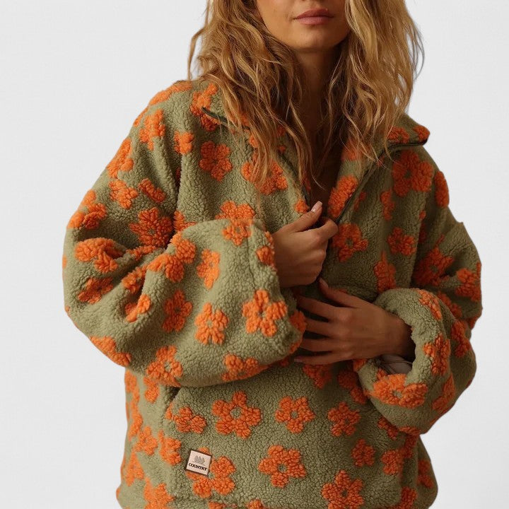 Fashionable women's floral half-zip sweater, ideal for elegant or casual wear, in yellow, pink, orange.