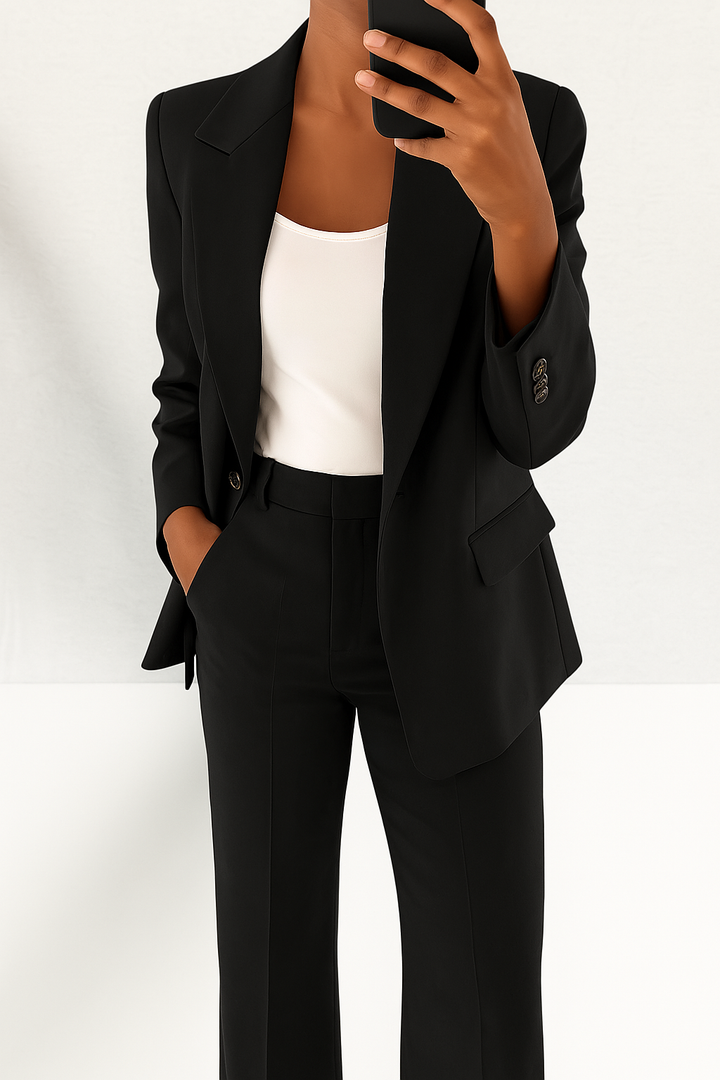 Sophisticated women's tailored pant suit. Elegant blazer & trousers offering a professional and modern look.