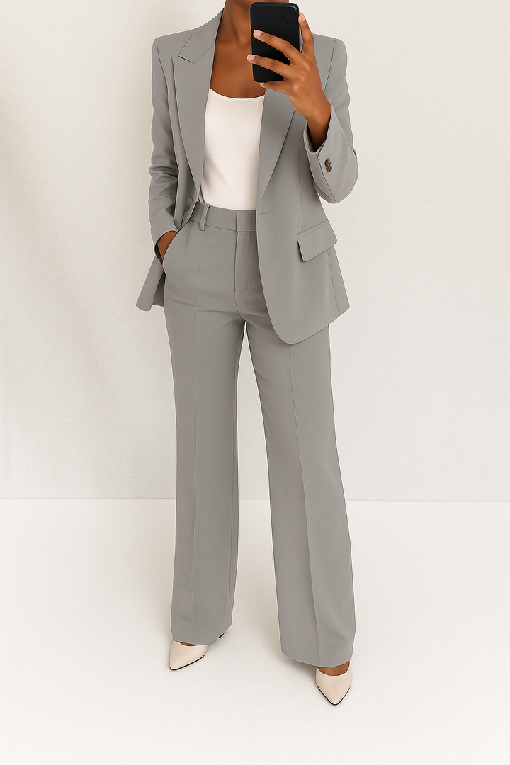 Versatile two-piece women's pant suit. Classic tailored blazer & comfortable trousers for formal occasions.