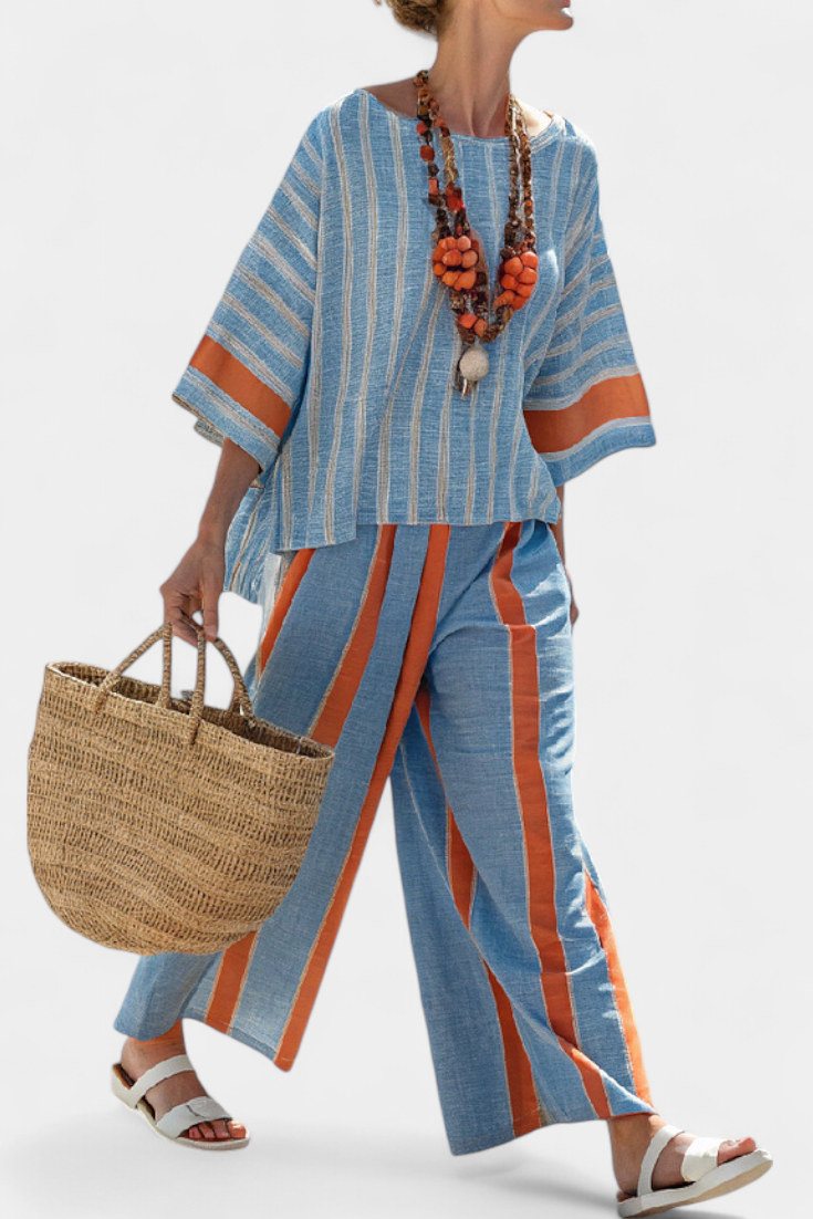 Women's sophisticated terracotta striped top & trousers set, perfect for elegant summer casual or resort wear.
