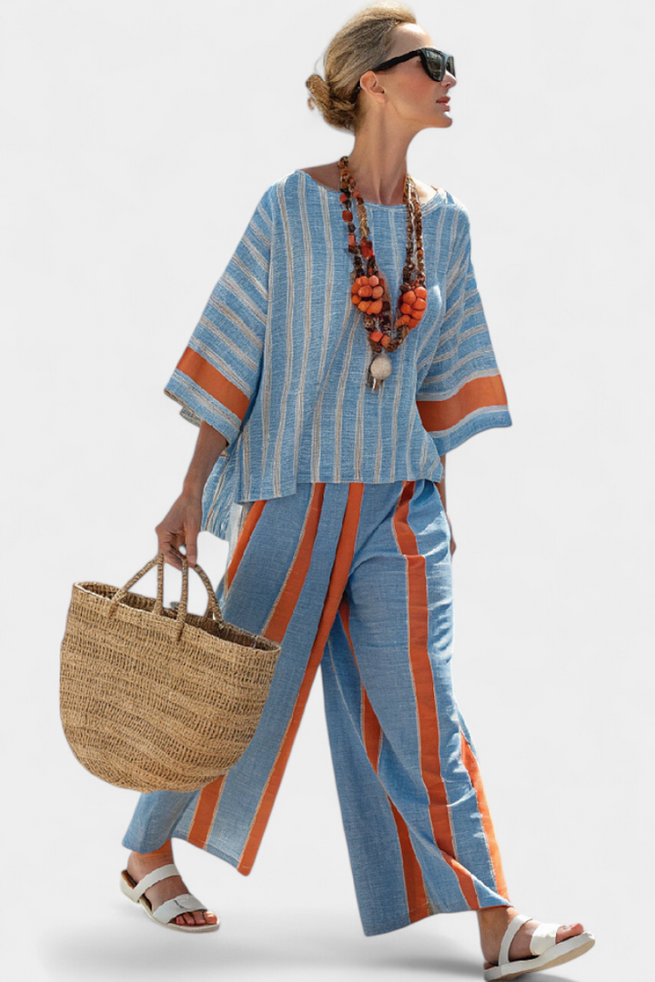 Stylish women's terracotta striped top & trousers set. Sophisticated, relaxed fit, perfect for summer travel & resort.