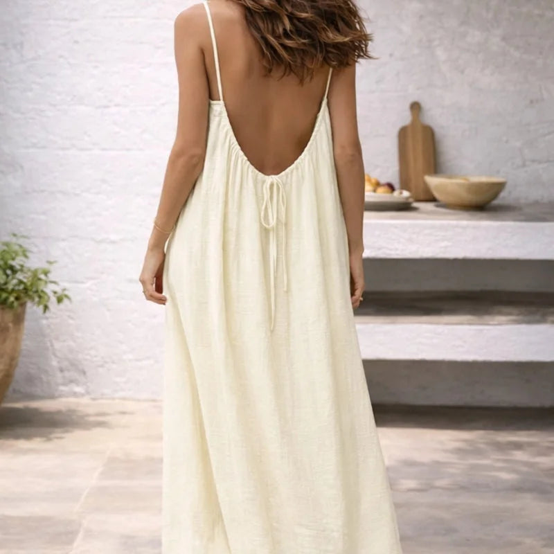 Breezy women's summer maxi dress with adjustable spaghetti straps and handy pockets for daily wear.