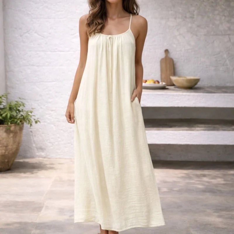 Women's beach maxi dress with spaghetti straps, offering comfort and style with convenient side pockets.