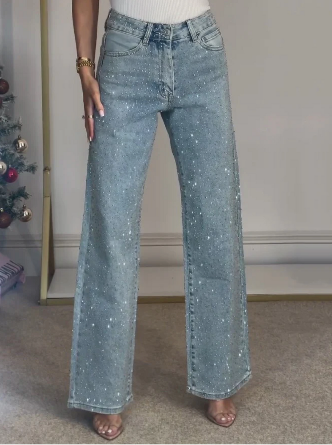 Modern women's denim pants featuring sparkle and straight leg cut
