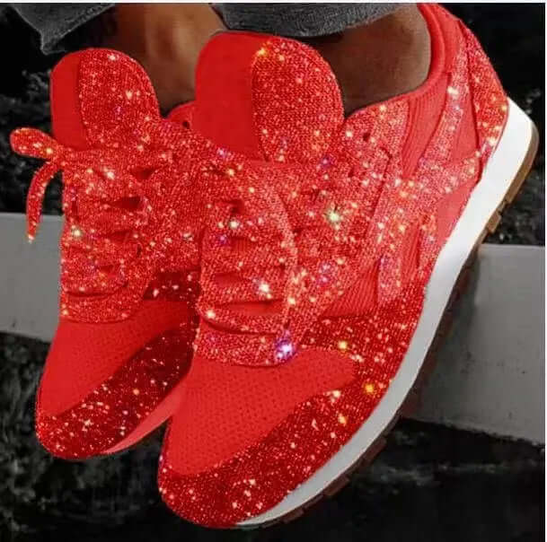 Pair of women's sparkling glitter trainers. Chunky platform shoes for a fashionable, elevated look. Comfortable & trendy footwear.