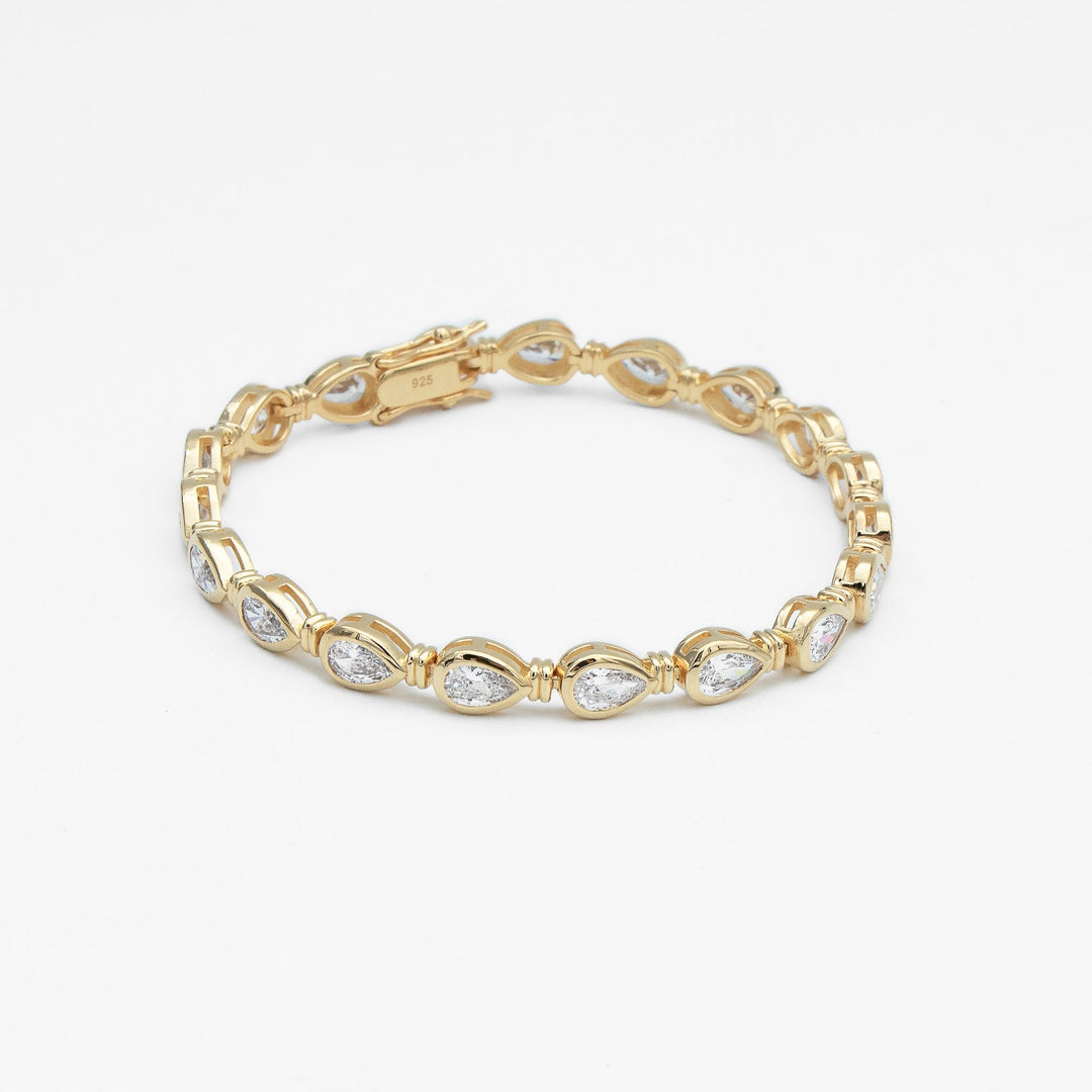 Women's sparkling padel bracelet: gold vermeil & sterling silver, with elegant pear stones. Luxury jewelry.