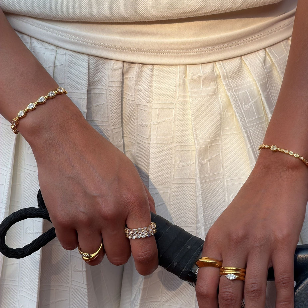 Two-tone women's padel bracelet: gold vermeil settings for pear stones on a sterling silver band. Elegant.