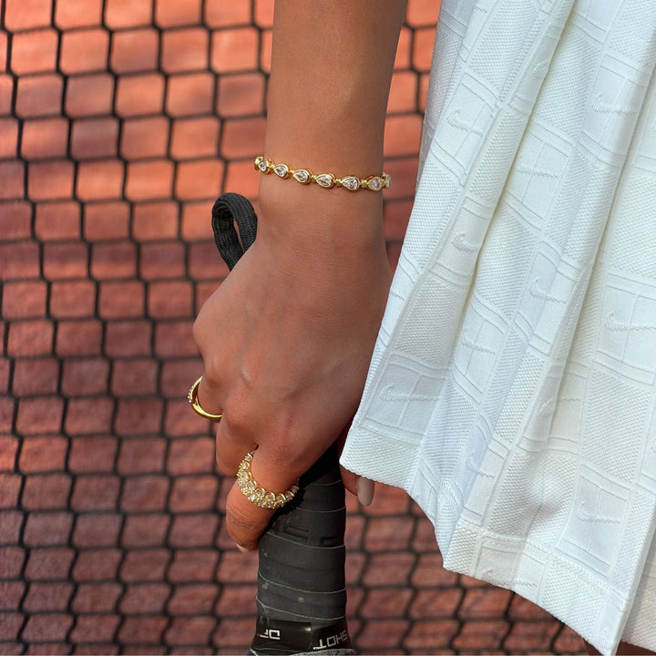 Dainty gold vermeil padel bracelet for women, featuring brilliant pear-cut stones on sterling silver. Stackable.