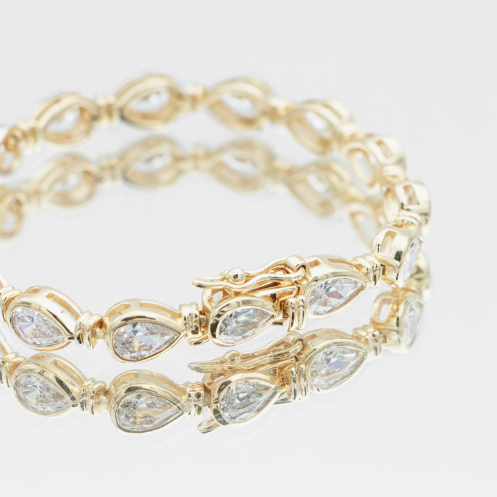 Elegant women's gold vermeil bracelet with shimmering pear stones, set on durable sterling silver. Dainty.