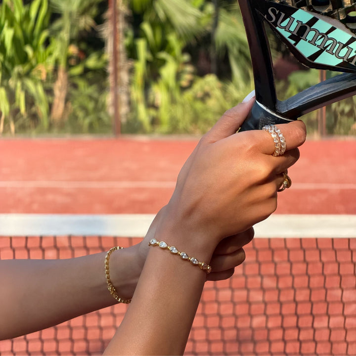 Chic women's padel bracelet, combining gold vermeil & sterling silver with dazzling pear stones. Timeless.