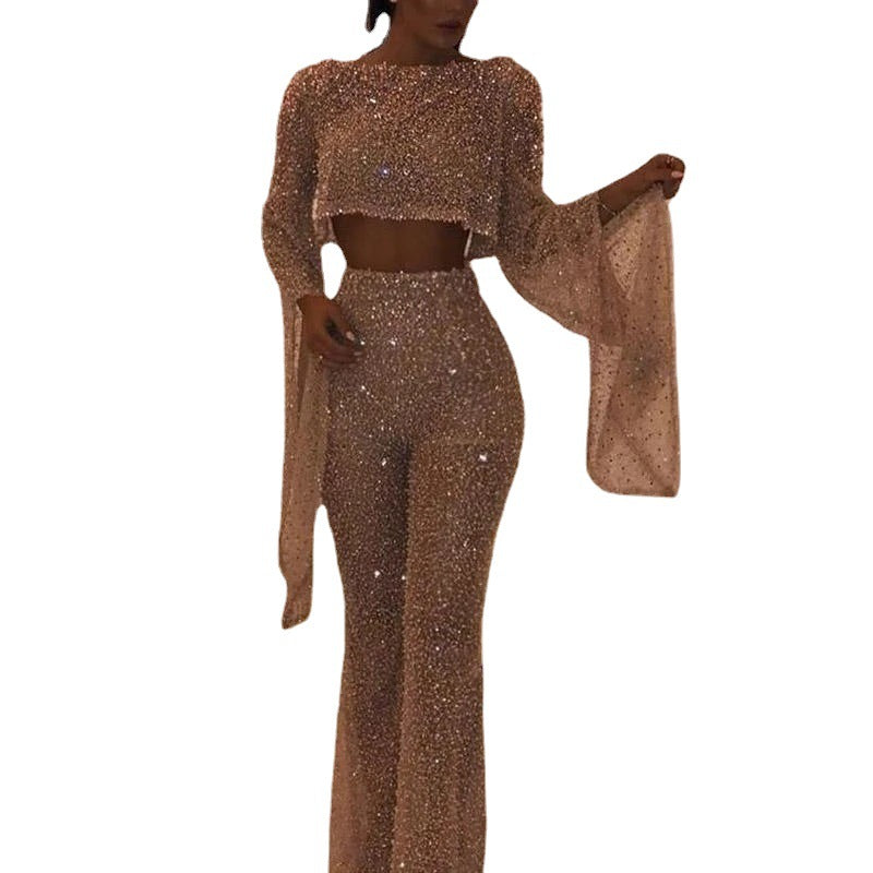 Stylish women's outfit: sparkling long sleeve top paired with wide leg pants.