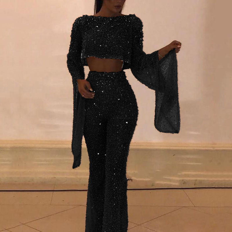 Chic style women's fashion: wide leg pants and long sleeve sparkling top.