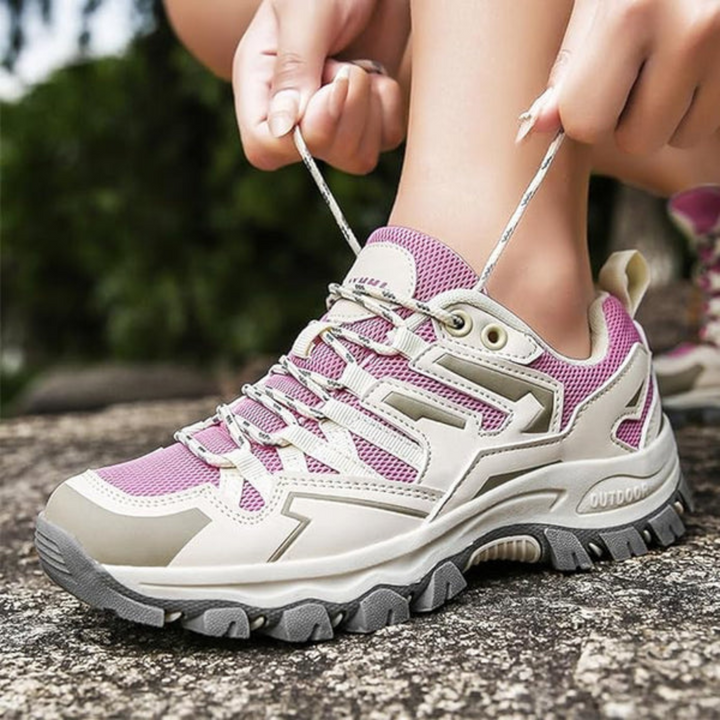 Purple women's sporty hiking shoes, designed for comfort and excellent grip on varied terrain.