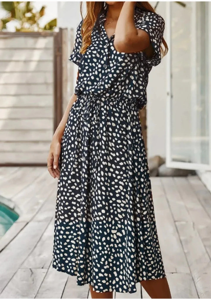 Women's spotted print midi. Button-down, flutter sleeves, adjustable drawstring waist for a perfect fit.