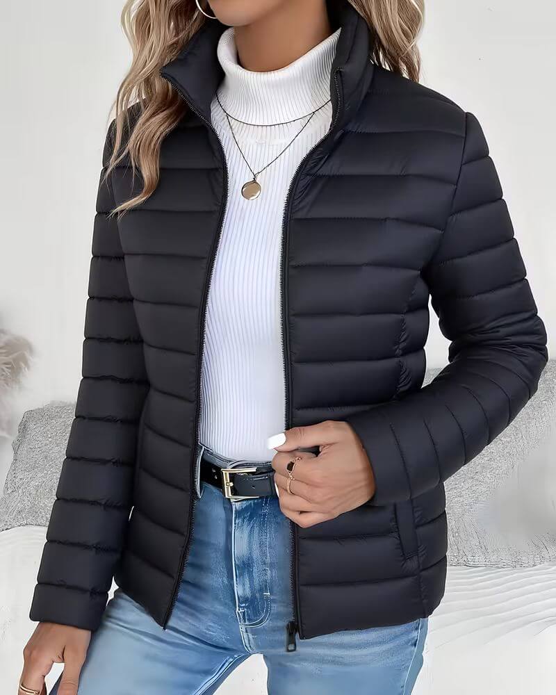 Casual women's cropped quilted puffer jacket with stand collar & zip closure. Ideal lightweight outerwear for layering.