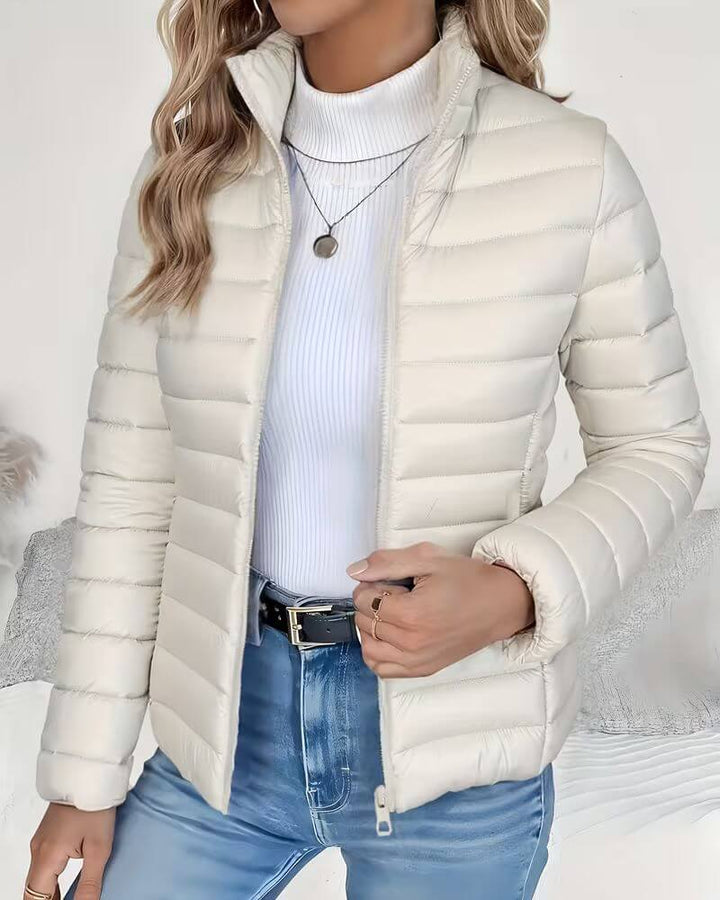 Womens lightweight cropped puffer jacket featuring a stylish stand collar, quilted finish, and practical zip closure.