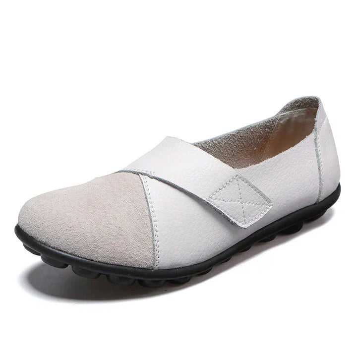 Durable women's comfort flats, paneled for support and easy slip-on convenience.
