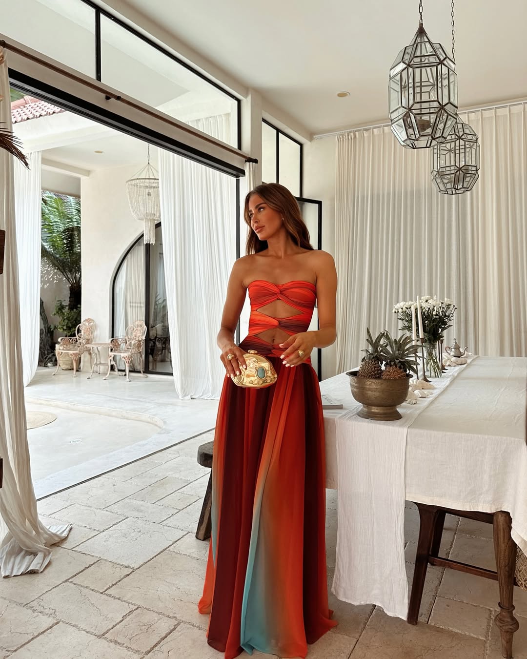 Women's strapless cut out maxi dress in a flowing summer style, perfect for elegant occasions.