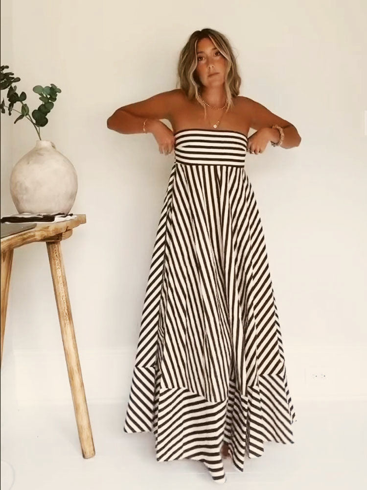 Women's strapless diagonal striped flare maxi dress. Elegant summer evening wear for special occasions.