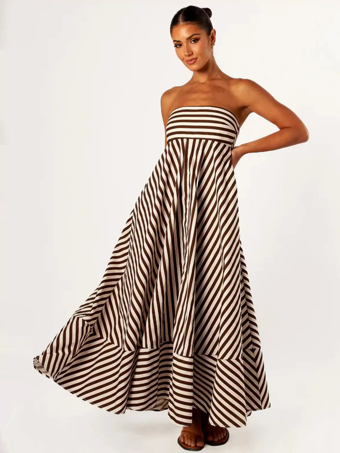 Chic women's strapless maxi dress featuring diagonal stripes and a flowing flare skirt for a graceful look.