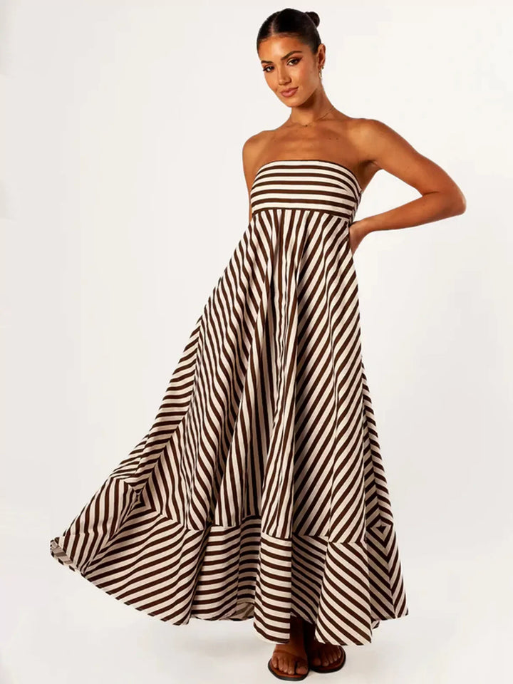 Chic women's strapless maxi dress featuring diagonal stripes and a flowing flare skirt for a graceful look.