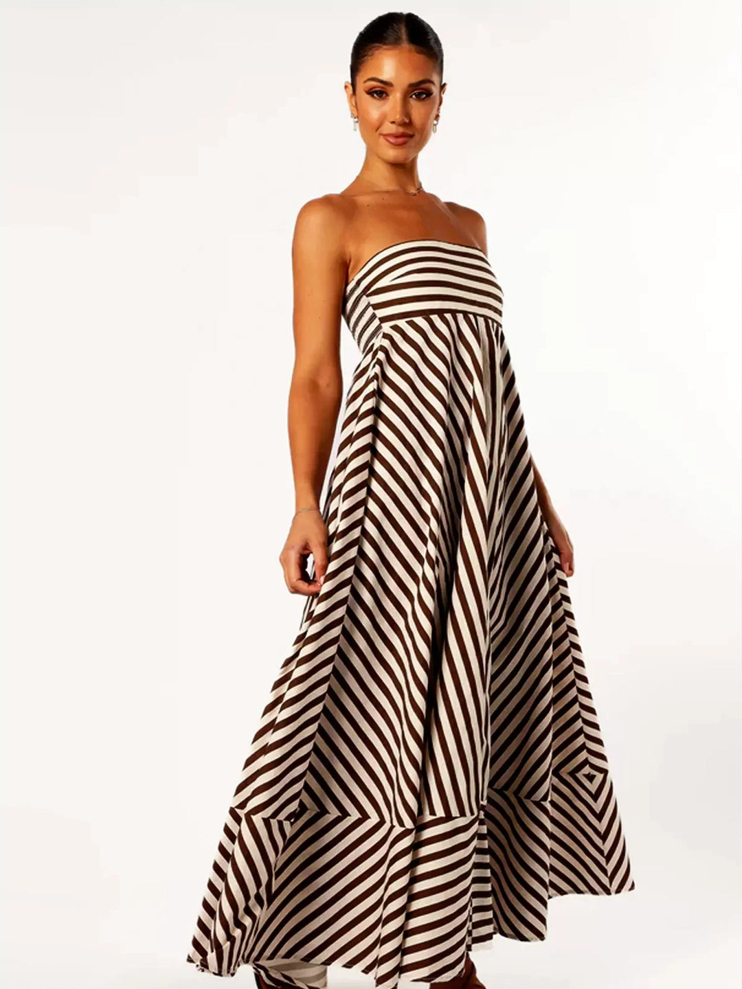 Women's strapless diagonal striped maxi dress with a flared hem. Perfect elegant summer outfit.