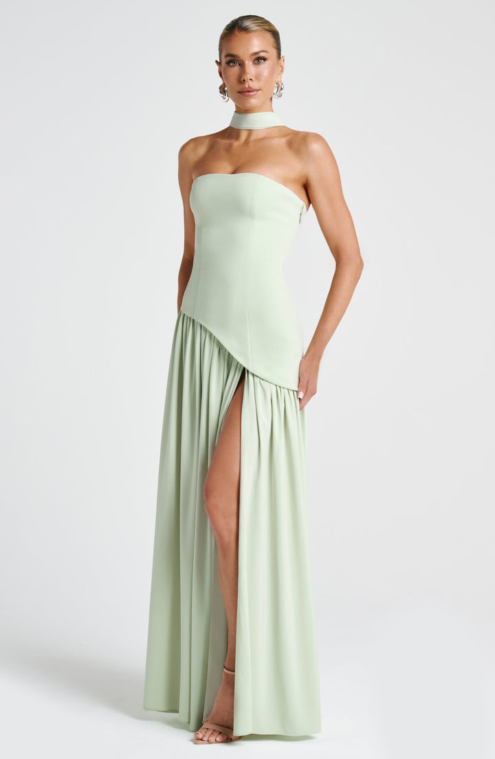 Chic strapless evening dress with a modern asymmetric waist and dramatic slit