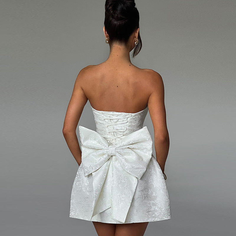 Elegant women's strapless mini dress. Features a flattering flared A-line cut for parties & evenings.