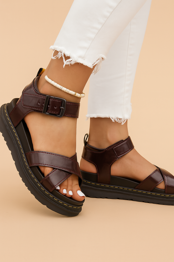 Comfortable women's platform sandals featuring a stylish strappy design and secure buckle.